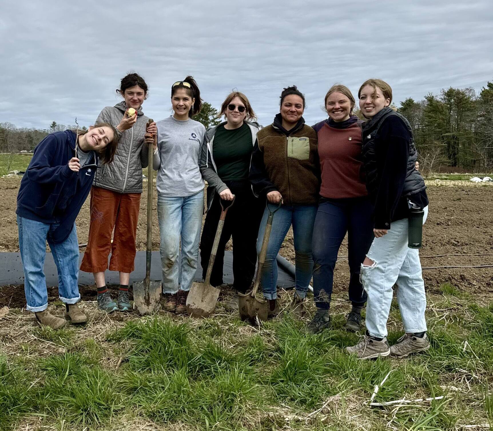 A group of children standing in a group and smiling for a picture